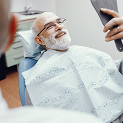 man smiling in the dental chair